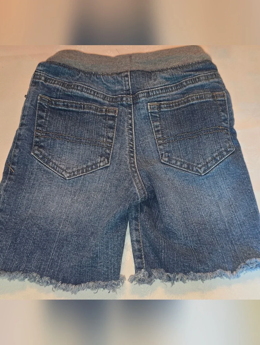 Cat & Jack frayed denim shorts featuring a dark wash